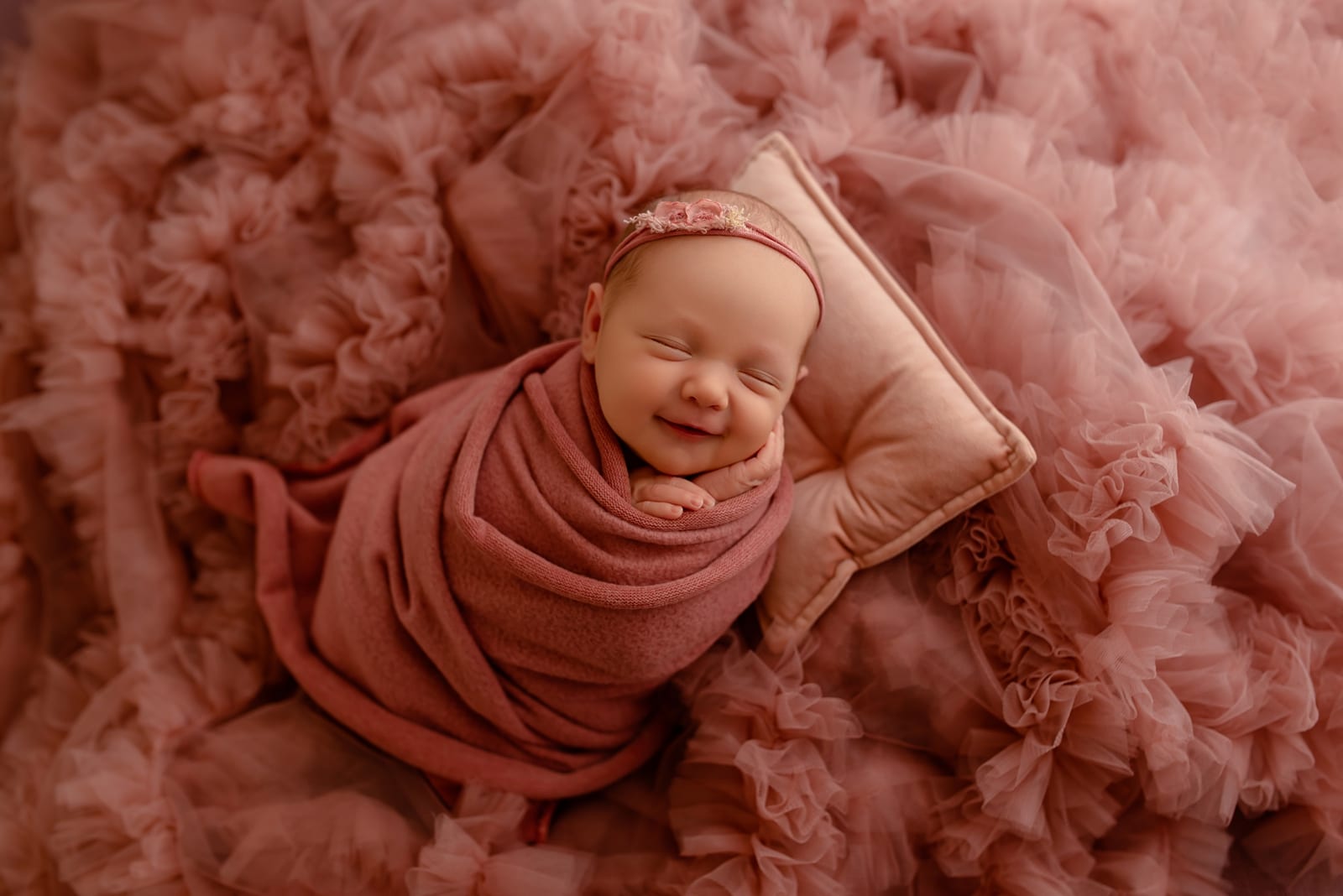 Newborn wrapped in pink